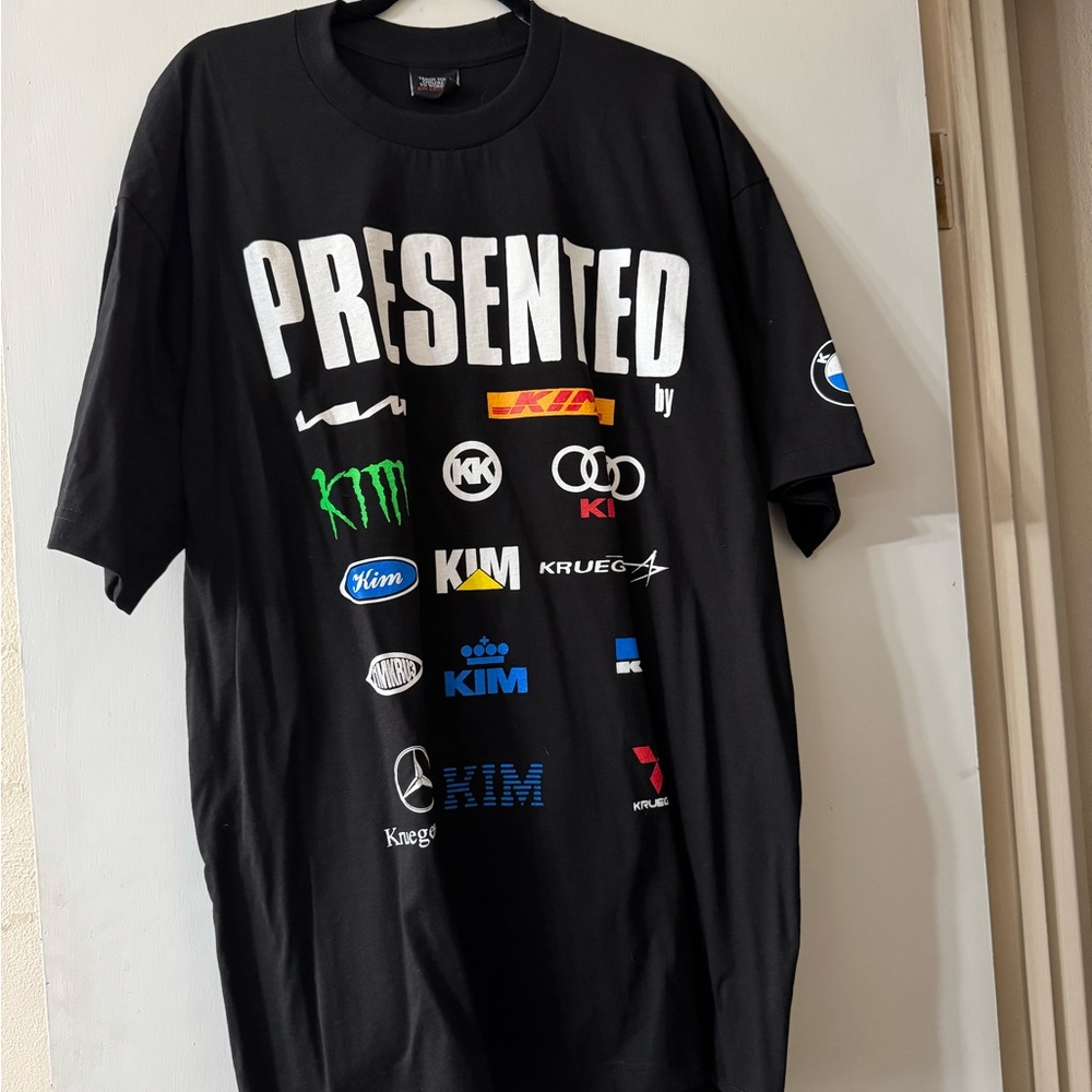 Kim Krueger Presented By Logo Black Graphic T-Shirt